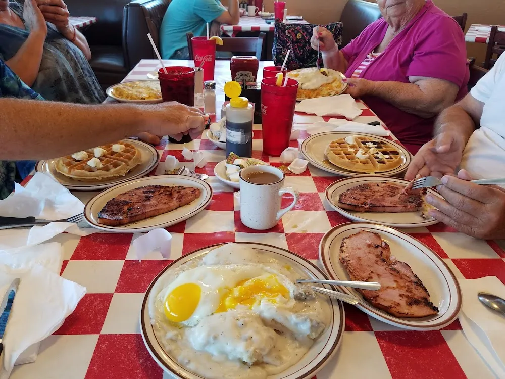 Biscuits and Gravy with Ham 2eggs on Top