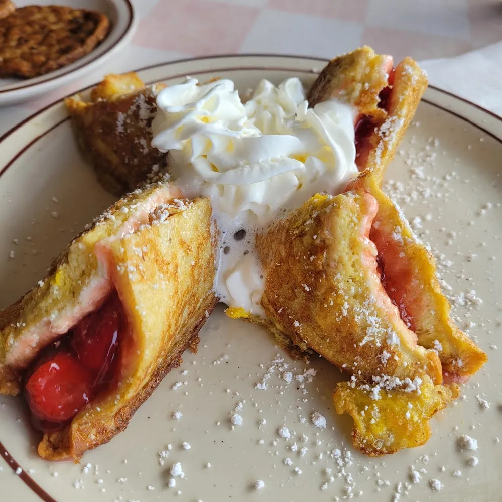 Stuffed French Toast with Strawberries or Blueberries and a Cloud of Whipped Cream